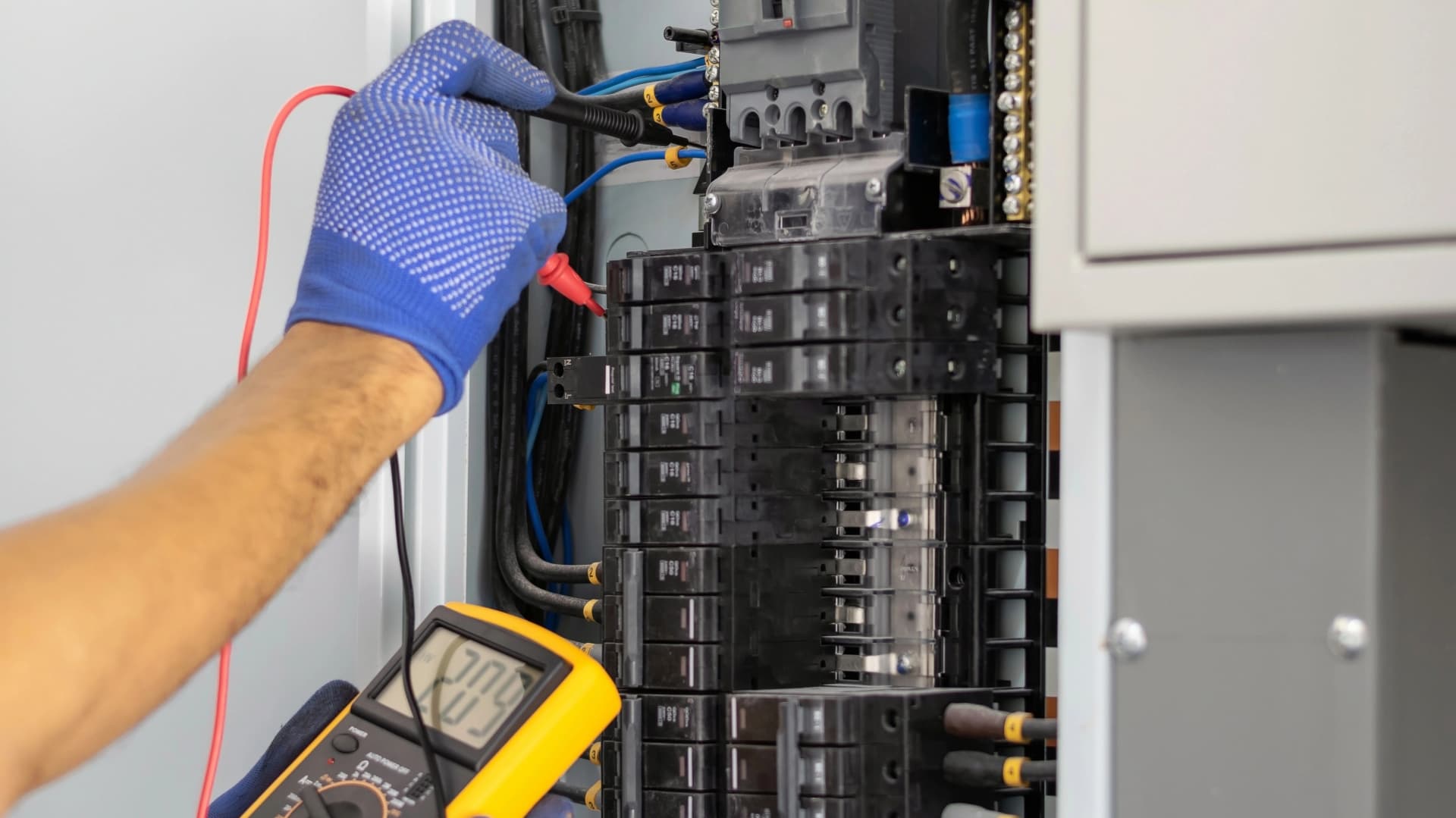 Electrician Testing Electrical Panel